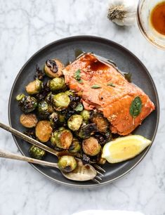 salmon and brussel sprouts on a plate