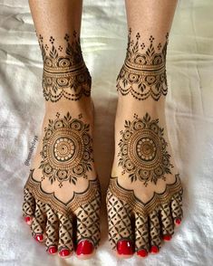 the feet are decorated with henna designs