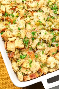 a casserole dish filled with stuffing and vegetables