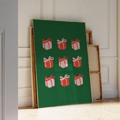 a green poster with red and white gift boxes on it in front of a door