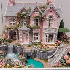 a pink doll house with flowers and plants on the roof, water fountain in front