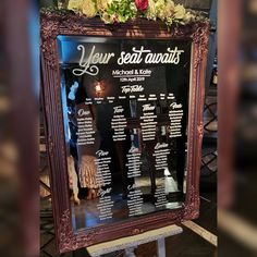 a large framed menu with flowers on it