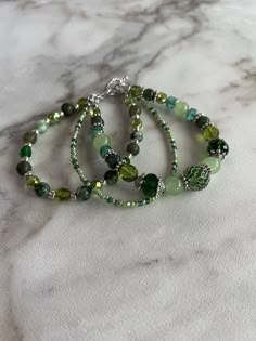 Cheap Hippie Beaded Bracelets For Gifts, Cheap Green Bohemian Bracelets, Affordable Hippie Beaded Jewelry, Earth Color Bracelets, Adjustable Glass Beaded Bracelets, Glass Beads Jewelry Fire Mountain Gems And Beads, Cheap Hippie Beaded Jewelry, Unique Green Beaded Bracelets, Cheap Green Beaded Friendship Bracelets