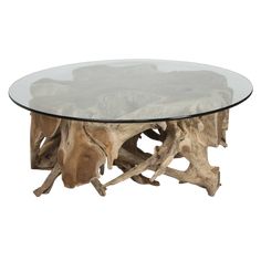 a table made out of driftwood with glass top