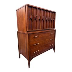 a wooden dresser with three drawers and two doors on the top, against a white background