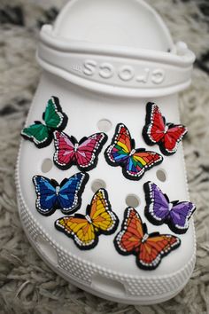 "These fun and cute butterfly PVC shoe charms will really make your shoes pop! Flexible and easy to remove and insert. Approximately 1.25\" wide. Perfect for gift giving or to keep yourself!" Croc Shoe Charms, Crocs Charms, White Crocs, White Cherry Blossom, White Cherries, Cherry Blossom Flowers, Cute Butterfly, Croc Charms, Star Butterfly