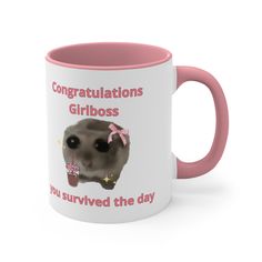 a pink and white coffee mug with an image of a gerbil