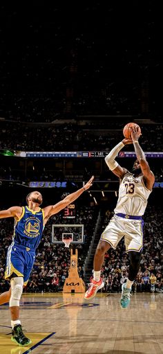 two basketball players in action on the court