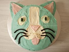 a cake decorated to look like a cat's face