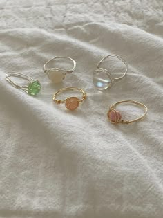 These multi color rings are not a set. They come separately. These rings come in gold or silver wire! Tarnish resistant also!! Homade Rings, Adjustable Wire Wrapped Stackable Rings, Dainty Wire Wrapped Round Ring, Minimalist Crystal Ring For Jewelry Making, Hand Wrapped Gold Crystal Ring, White Wire Wrapped Rings As Gift, Wire Wrapped Open Metal Ring, Wire Wrapped Rose Gold Rings, Pink Adjustable Metal Rings