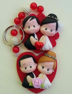 two keychains that have been made to look like bride and grooms on them