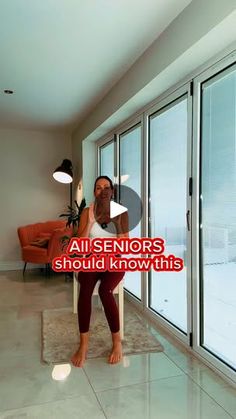 a woman standing in front of a large window with the words aisenors should know this