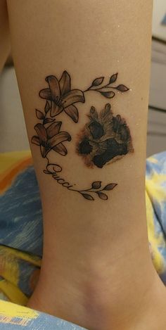 Dog tattoo, flower Dog Pawprint Tattoo With Flowers, Paw Prints With Flowers Tattoo, Dog Paw Flower Tattoo, Dog Paw Tattoo With Flowers, Flower Paw Print Tattoo, Paw Print Flower Tattoo, Floral Paw Print Tattoo