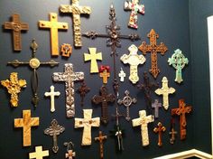 the wall is covered with many different crosses on it's sides, including one for each of them