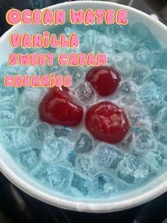 three cherries in ice water with the words ocean water vanilla sweet cream chocolates