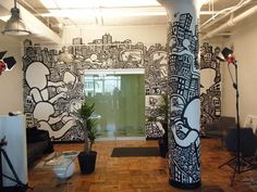 an office decorated with black and white graffiti