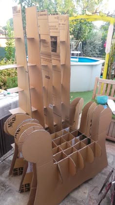 the cardboard chair is made to look like it has been cut out and put together