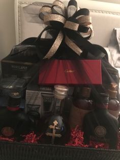 a basket filled with liquor bottles and condiments