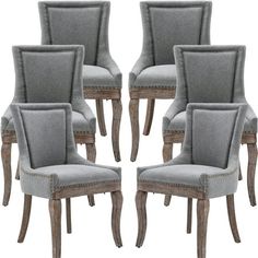 set of six grey upholstered chairs with nail polishing on the legs and back