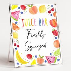 a sign that says juice bar freshy squeezed with fruit around it and on the front