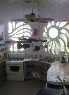 a kitchen with an oven, stove and sink