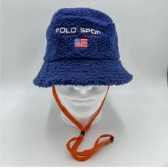 Polo Ralph Lauren Men’s Polo Sport Logo Fleece Bucket Hat Blue Size S/M Come With String But Can Be Taken Off Easily.Unisex Blue Bucket Hat For Outdoor, Casual Navy Bucket Hat For Outdoor, Navy Casual Beanie Hat, Navy Casual Winter Hats, Blue Flat Brim Bucket Hat One Size, Blue Flat Brim Bucket Hat, Blue Winter Bucket Hat With Curved Brim, Blue Brimmed Bucket Hat For Outdoor, Casual Navy Brimmed Bucket Hat