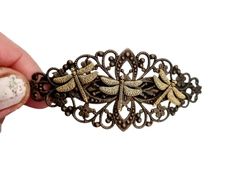 Excellent quality ancient bronze and copper dragonfly hair barrette.  Antique look handmade barrette.  Approx 8 x 3 cm actual clip is 7 cm. Non slip,double clasp.  Suitable for all hair types. Thank you for visiting my items. Dragonfly Hair Clip, Victorian Hair Clips, Vintage Hair Barrettes, Art Nouveau Hair Pin, Metal Hair Clips Vintage, Bronze Hair, Vintage Hair Clips, Barrette Clip, Hair Barrettes