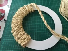 a piece of twine is being used to make a wreath