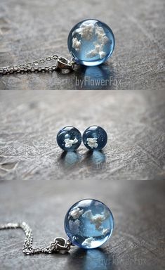 three different images of the earth in glass balls