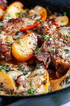 a skillet filled with meat and vegetables covered in gravy