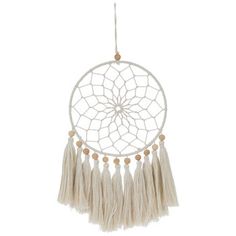 a white and beige dream catcher hanging from a string with beads on the end, in front of a white background