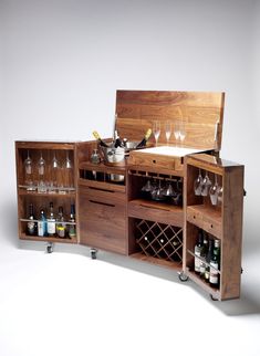 a wooden cabinet with wine glasses and bottles in it