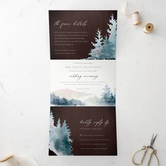 two wedding cards with watercolor trees on them