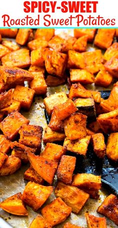 roasted sweet potatoes on a baking sheet with text overlay that reads spicy - sweet roasted sweet potatoes