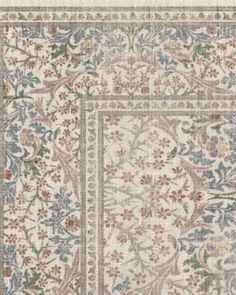 an area rug with floral designs on the side and a border in the middle,