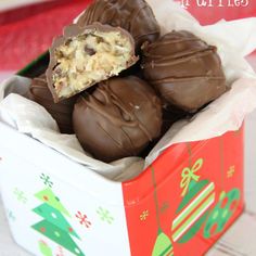 a box filled with chocolate covered cookies on top of a table