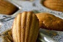 some almonds are sitting in a muffin tin