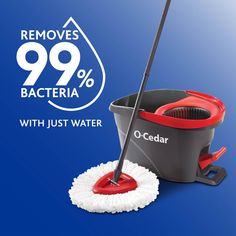 a red and black mop sitting on top of a blue floor next to a cleaning bucket