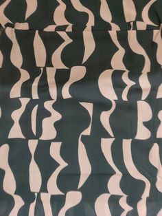 an abstract black and white pattern with wavy lines on the fabric, as if it were made out of paper