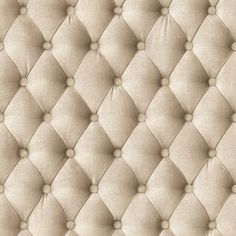 an upholstered beige fabric with buttons