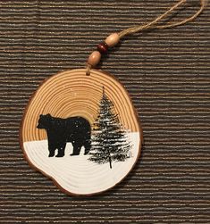 a wooden ornament with a bear on it