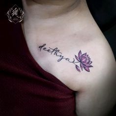 a woman with a tattoo on her chest that says,'pretty day'in cursive writing