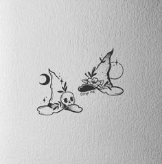 some type of ink drawing on paper with an image of two witches and a moon