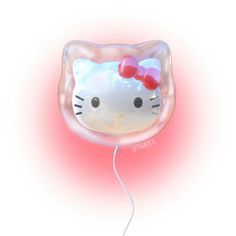 a hello kitty balloon floating in the air