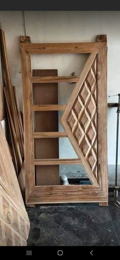 an open wooden door sitting on top of a floor