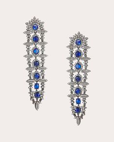 Artisanally crafted in Jaipur, the Himmat earrings decorate their ornate drop design with a stunning array of round-cut diamonds. Oval blue sapphires are arranged in linear fashion from the posts to ends to create a central focal point. White gold-plated sterling silver, kyanite and diamond Carat: 5.16 ctw diamond, 6 ctw kyanite Polish with soft cloth Made in India Sapphire And Diamond Earrings, Drop Design, Drops Design, 14kt Gold, Round Cut Diamond, Gold Plated Sterling Silver, Jaipur, Blue Sapphire, Diamond Bracelet