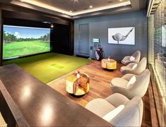 a golf simulator is set up in the middle of a room