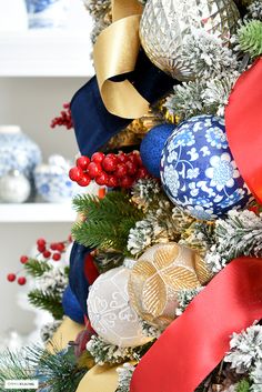 a christmas tree decorated with ornaments and ribbons