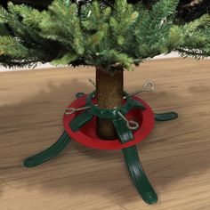 a small christmas tree in a red holder