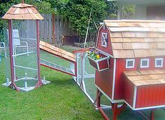 a red chicken coop with a wooden roof